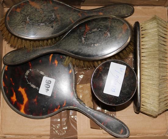 A 1920s six piece silver and tortoiseshell mounted dressing table set.